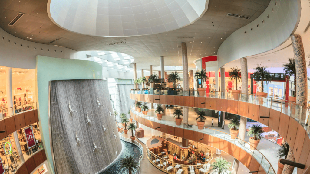 "Illustration showcasing the exterior of Dubai Mall, the world's largest shopping mall, with bustling crowds and iconic architecture in Dubai.