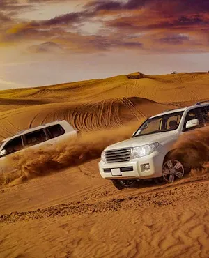 Two land cruisers in Dubai desert