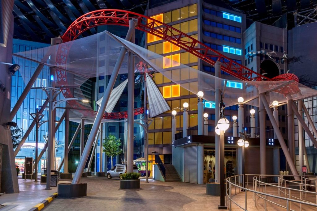 When Thrill Meets Tradition: Ramadan 2026 at IMG Worlds of Adventure
What if you could break your fast under glowing lanterns… and then ride a roller coaster minutes later?
That’s exactly what Ramadan 2026 at IMG Worlds of Adventure promises, a magical blend of Arabian Nights ambiance, cultural celebration, delicious Iftar spreads, and world-class indoor thrills, all under one massive air-conditioned roof in Dubai.
While most Ramadan evenings revolve around quiet gatherings and traditional tents, IMG transforms the holy month into something uniquely modern yet deeply respectful, a place where families, friends, and visitors can celebrate together in a festive, immersive environment.
If you’re planning your Ramadan in Dubai, this complete guide covers event highlights, Iftar details, timings, ticket tips, attractions, family experiences, travel advice, and FAQs, everything you need to plan the perfect visit.
What Is Ramadan at IMG Worlds of Adventure?
During Ramadan, IMG Worlds of Adventure hosts its Arabian Nights Ramadan Season, turning the park into a beautifully decorated cultural destination.
Expect:
Lantern-lit walkways and crescent installations
Live cultural entertainment
Special Iftar dining packages
Full access to thrilling rides
A family-focused evening atmosphere
Unlike outdoor Ramadan venues, IMG offers a fully indoor, climate-controlled experience, making it one of Dubai’s most comfortable Ramadan destinations.
Arabian Nights Ramadan Season 2026 – What Makes It Special?
Immersive Ramadan Decor
During Ramadan 2026, IMG Worlds of Adventure undergoes a stunning transformation inspired by the timeless charm of Arabian Nights. As you walk through the park, you’ll notice traditional Ramadan lanterns glowing softly overhead, casting warm golden hues across the indoor boulevards. Crescent moon installations and intricate decorative elements add to the spiritual and festive atmosphere, creating a setting that feels both elegant and culturally rich.
Every corner is thoughtfully designed to reflect the beauty of the holy month, from illuminated pathways to carefully curated photo backdrops that are perfect for capturing memorable family moments. The transformation makes the park feel less like a conventional theme park and more like a vibrant cultural celebration space where tradition and entertainment blend seamlessly.
Evening Entertainment & Cultural Shows
After Iftar, the atmosphere at IMG Worlds of Adventure becomes lively yet respectfully aligned with the spirit of Ramadan. Instead of the usual high-energy theme park soundtracks, music is kept at a moderate volume and often features traditional Arabian melodies such as Oud and Qanun, complementing the Arabian Nights theme.
You can enjoy culturally inspired performances and family-friendly stage shows that reflect regional heritage. The post-Iftar hours feel festive and engaging, while still maintaining the calm, respectful ambiance of the holy month.
Iftar at IMG Worlds of Adventure 2026
Breaking your fast at IMG Worlds of Adventure is one of the highlights of the Ramadan season, but it’s helpful to understand exactly what’s included.
What the Official Iftar Buffet Typically Offers
The dedicated Ramadan Iftar buffet is usually hosted at Flavours of Arabia and is heavily centered around Middle Eastern and Indian cuisine.
Are All Rides Open During Ramadan?